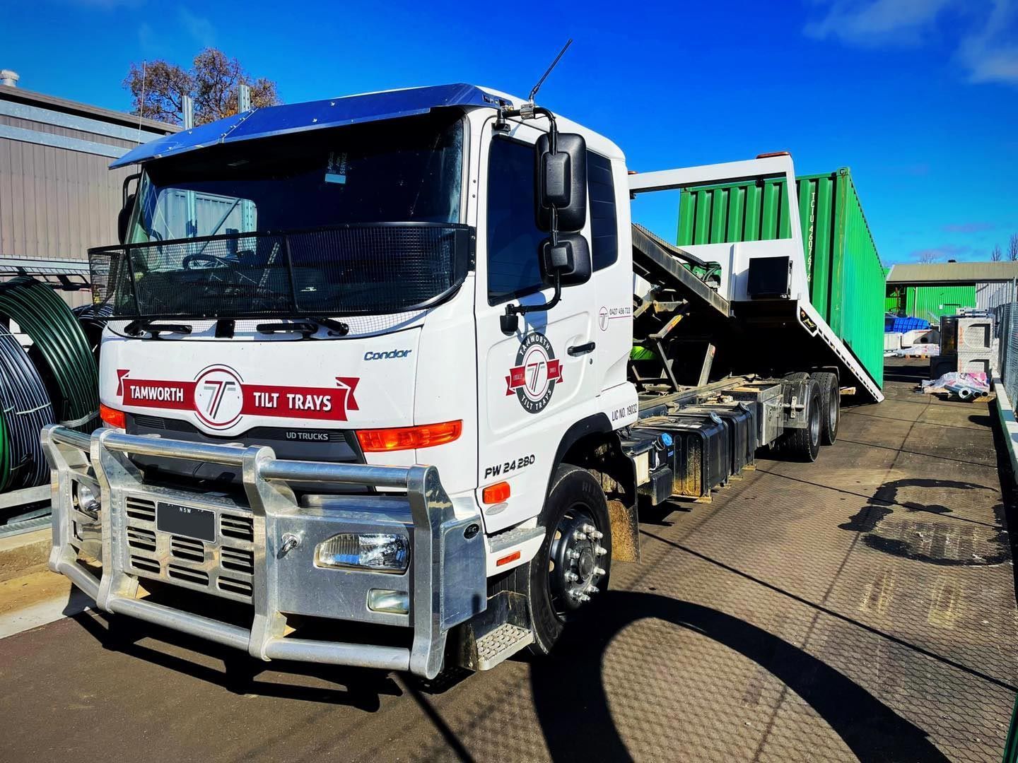 A White Hino Truck With a Bull Bar is Parked Outdoors — Tamworth Tilt Trays in Tamworth, NSW