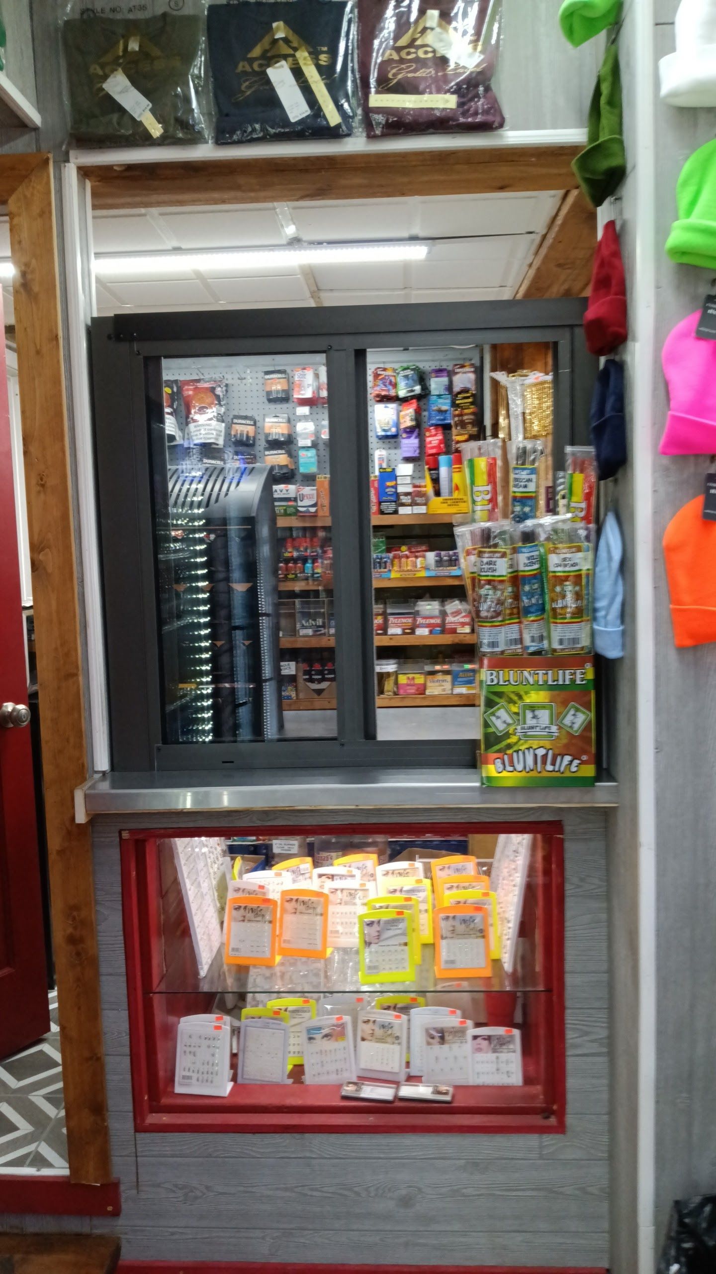A bathroom with a bathtub and a skylight in the ceiling