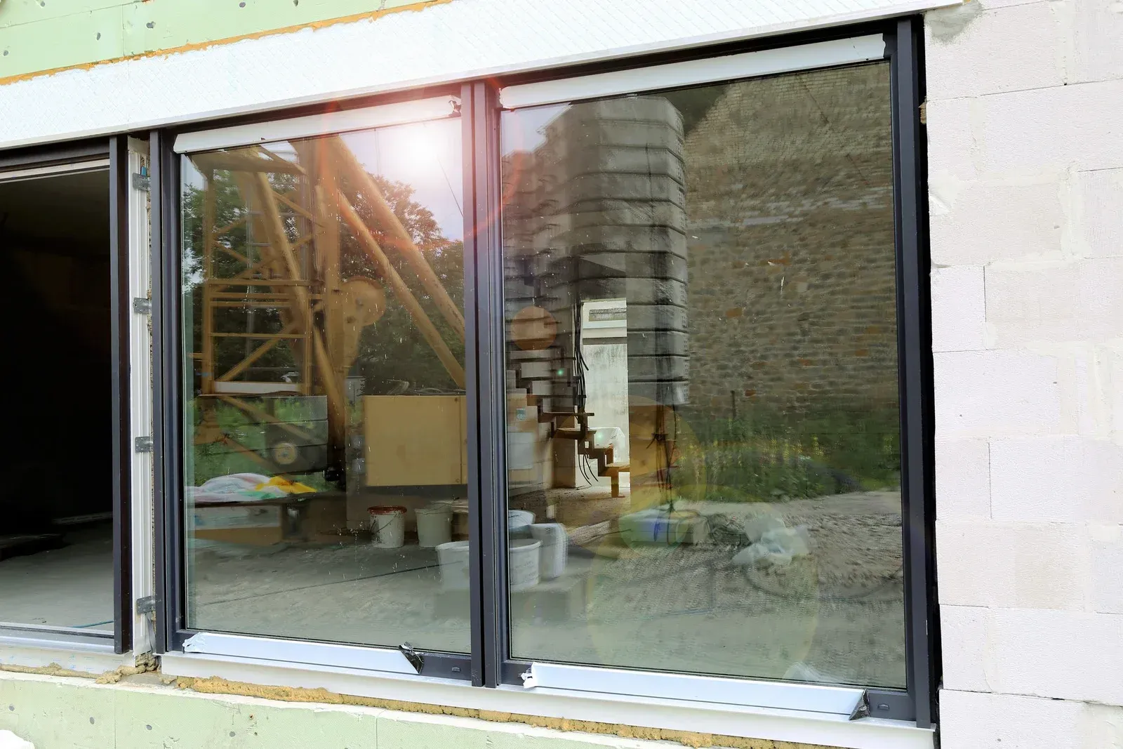 A building under construction with a red roof