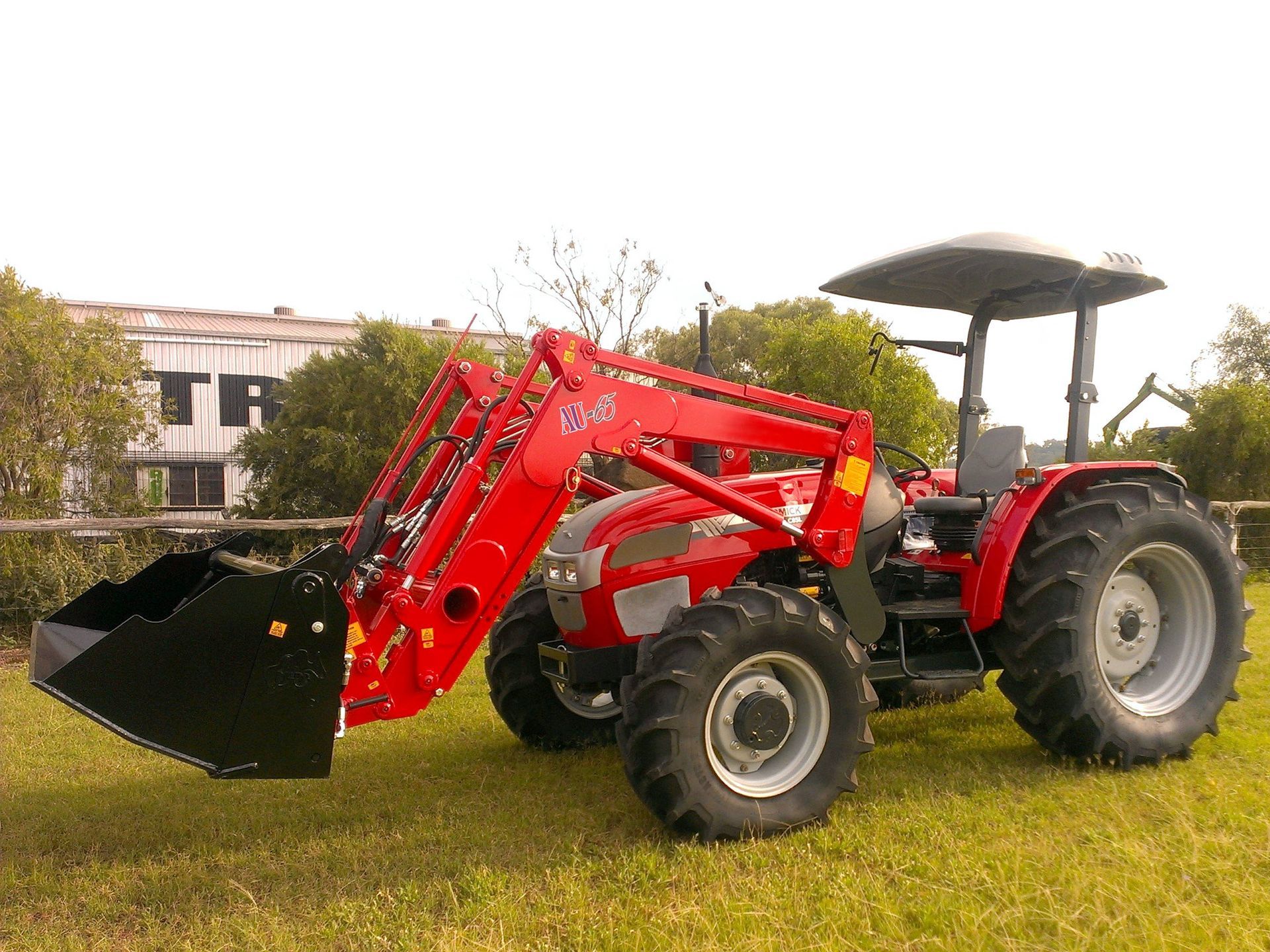 a photo of a McCormack AU65 Front End Loader fitted to a tractor