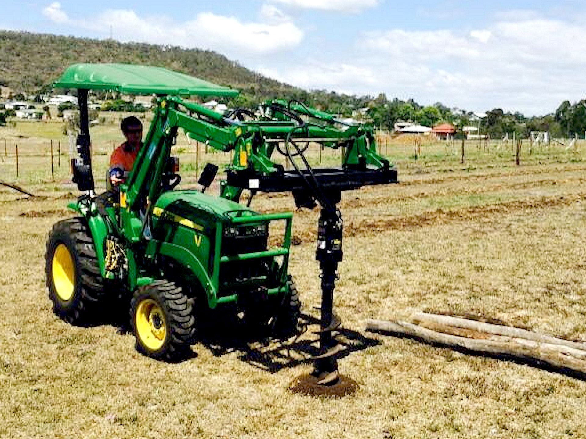 John Deere tractor post hole digger