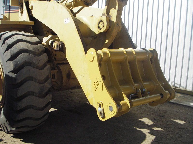 A yellow bulldozer with a bucket attached to it