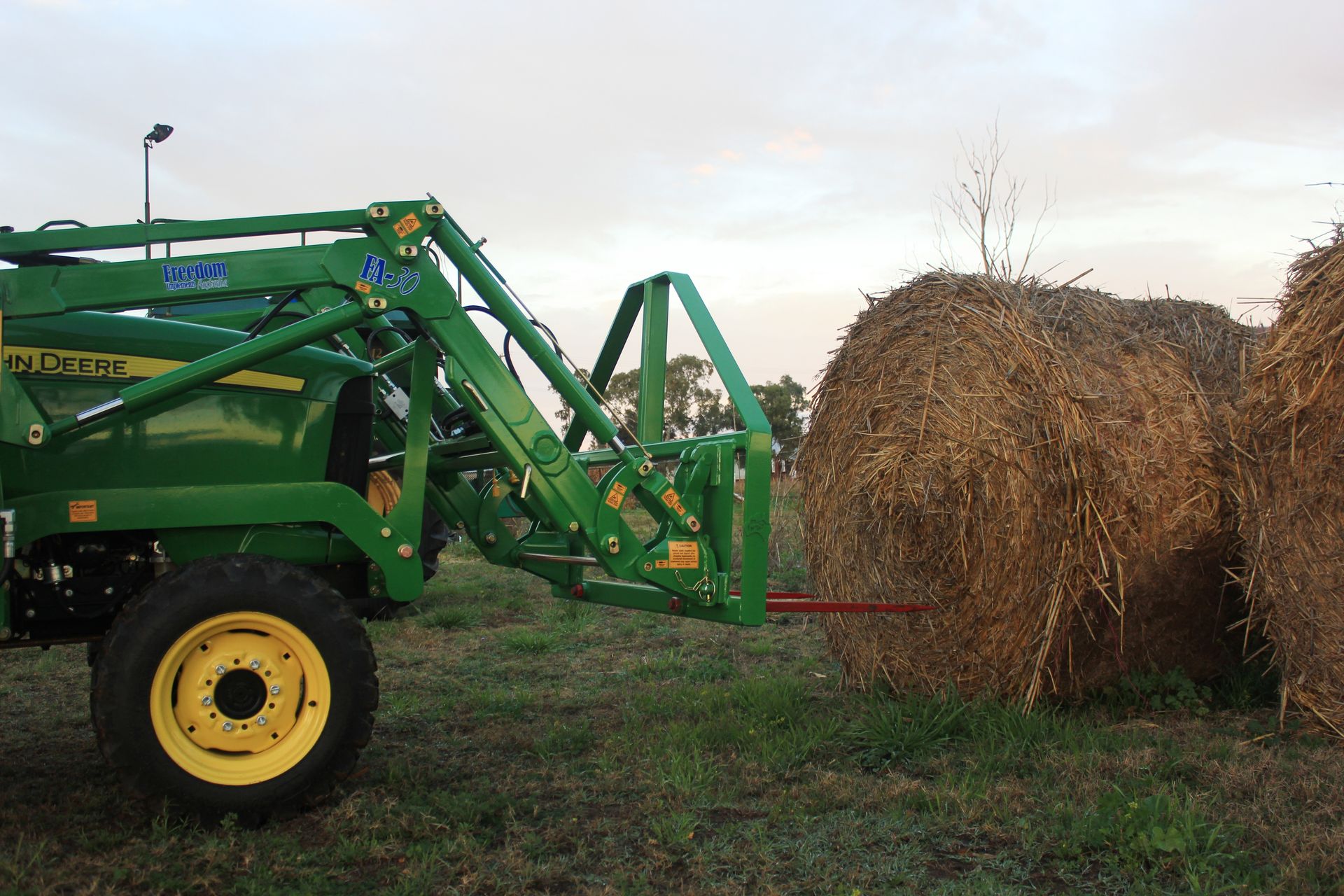 John Deere tractor with bale spike