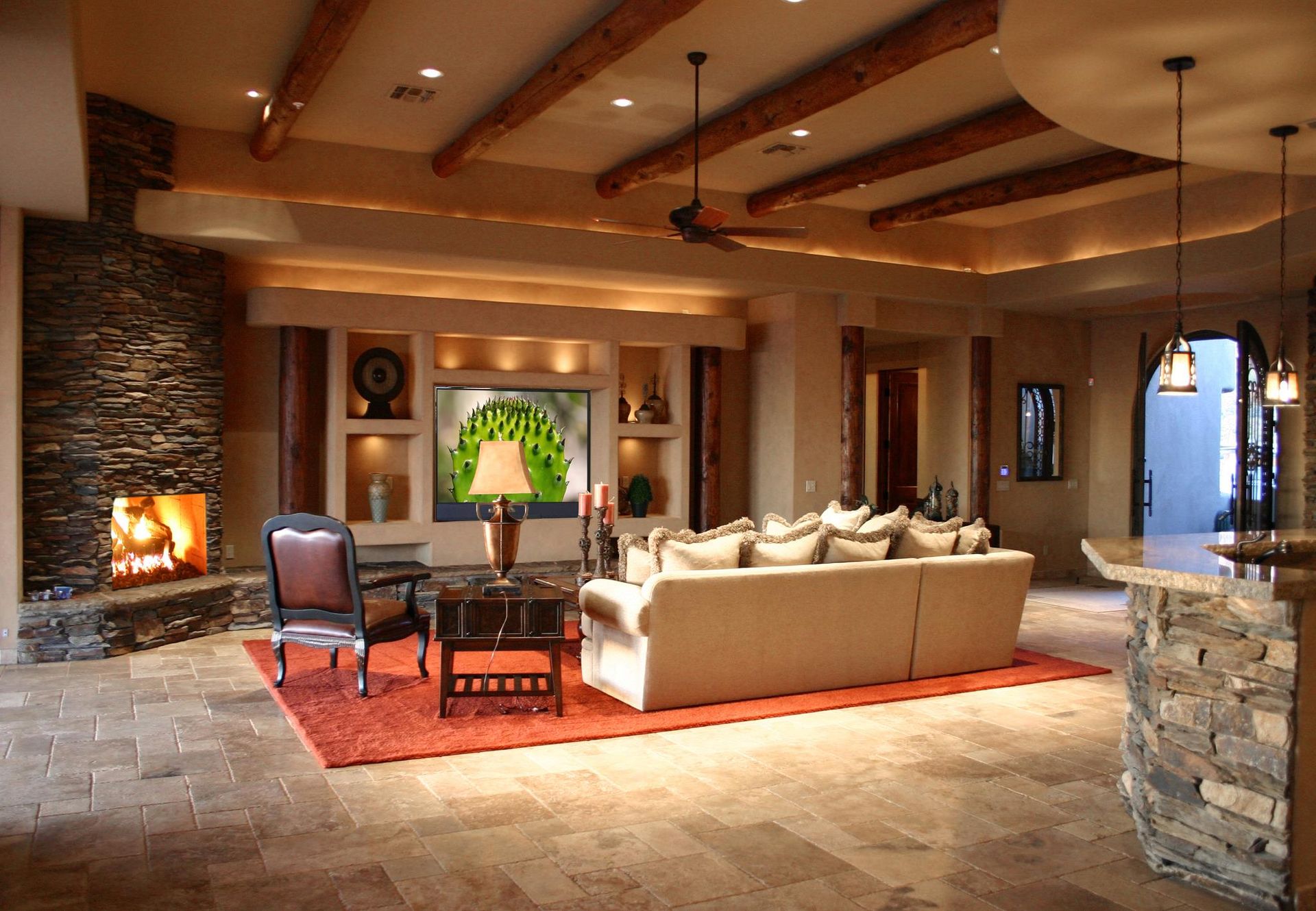 A living room with a couch and chairs and a fireplace