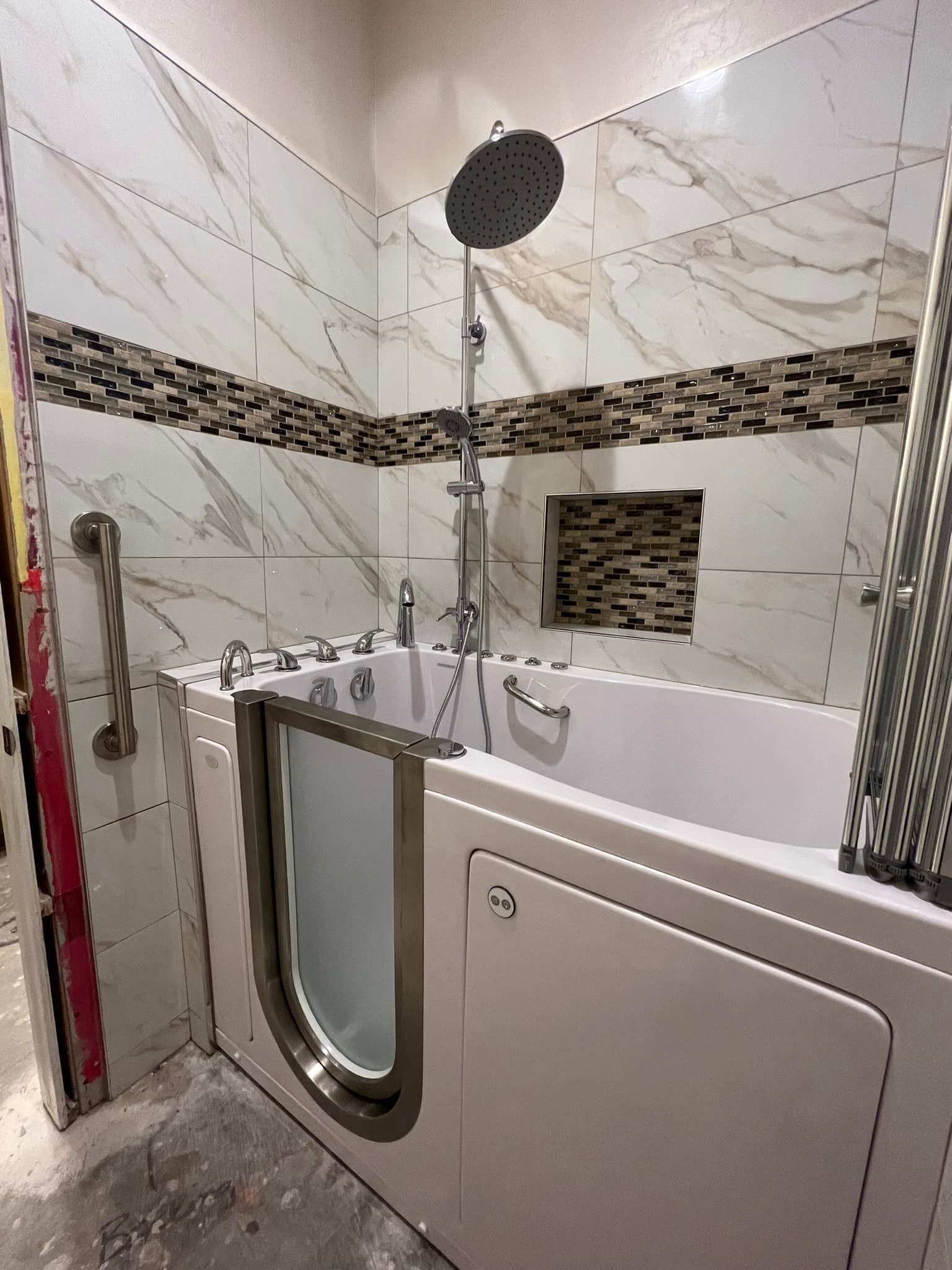 A bathroom with a walk in tub and a shower.