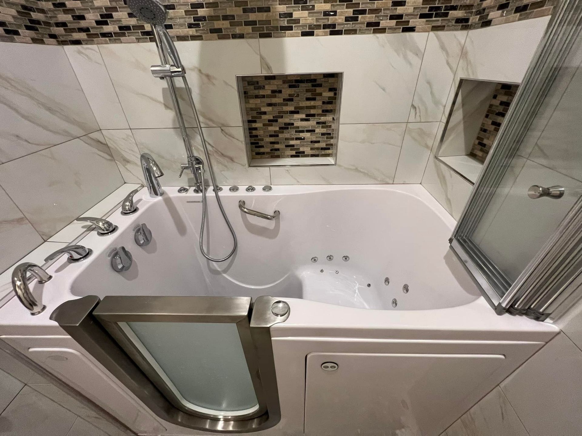 A bathroom with a walk in tub and a shower.