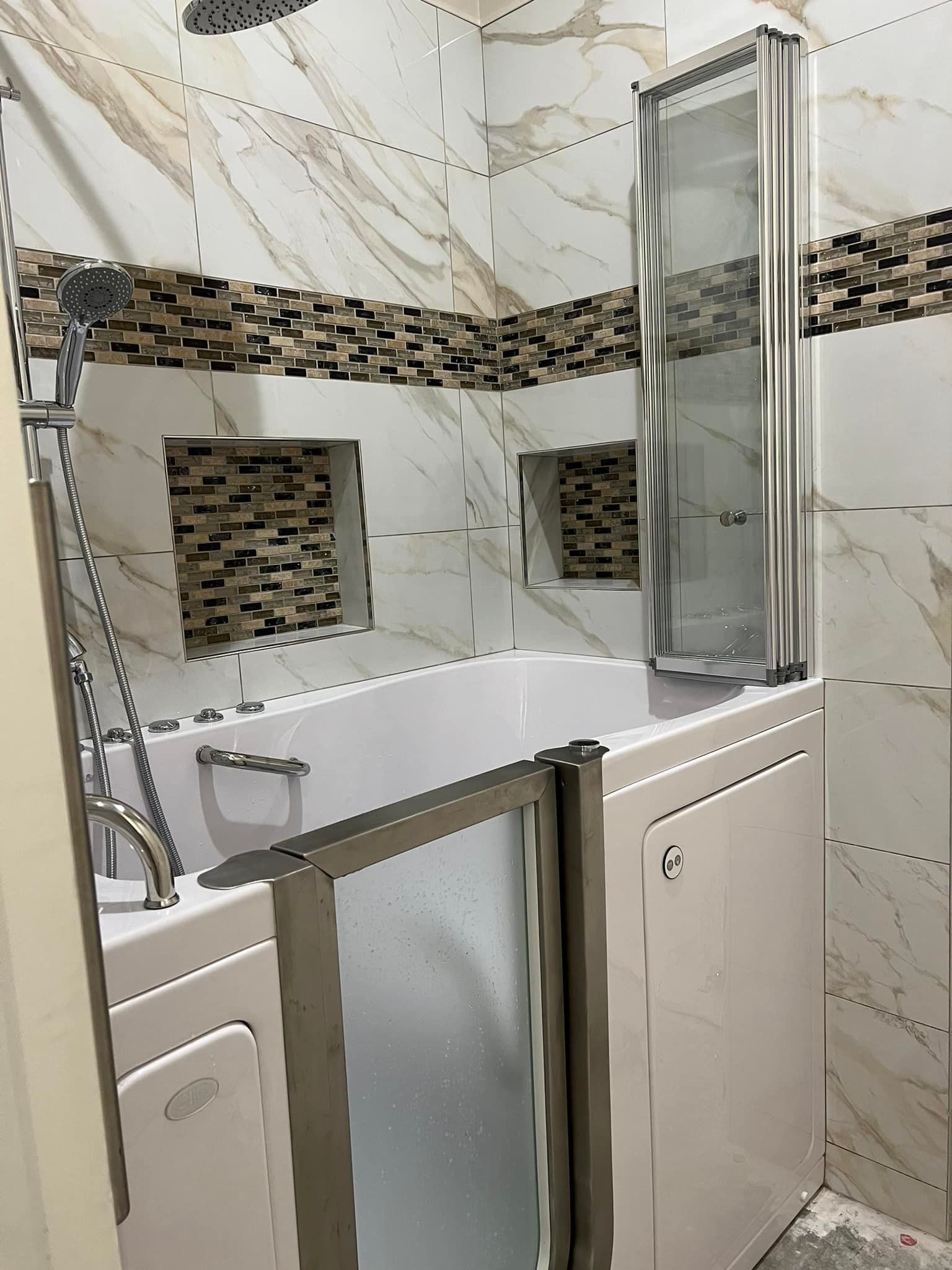 A bathroom with a walk in tub and a shower.