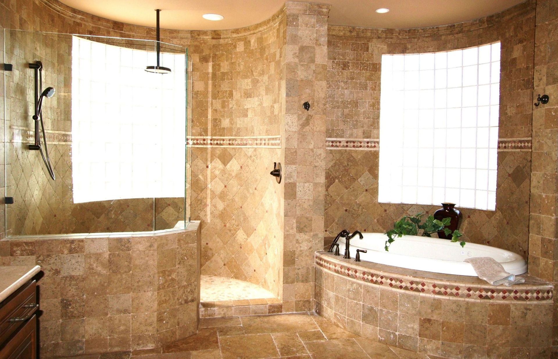 A bathroom with a tub , shower and window
