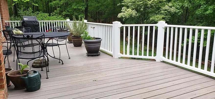 wooden deck with white fence