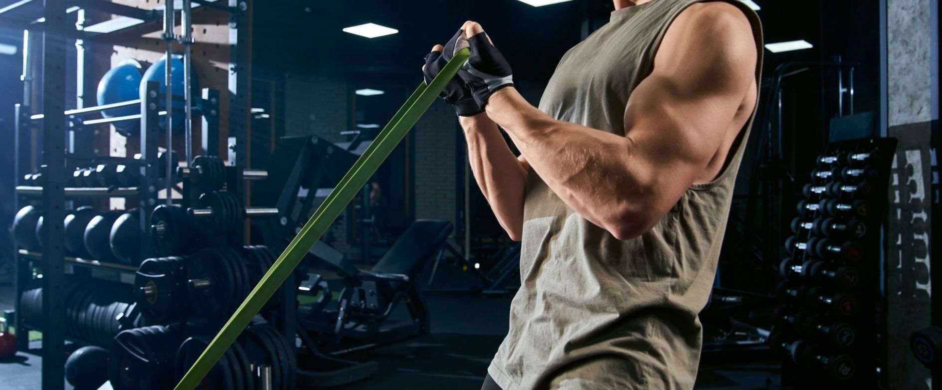 Strong man doing resistance band curls