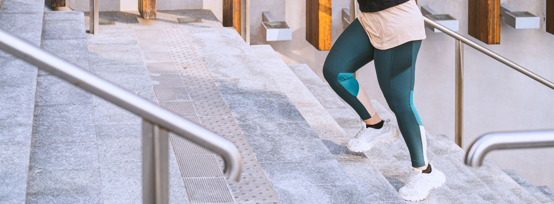 Woman running up stairs