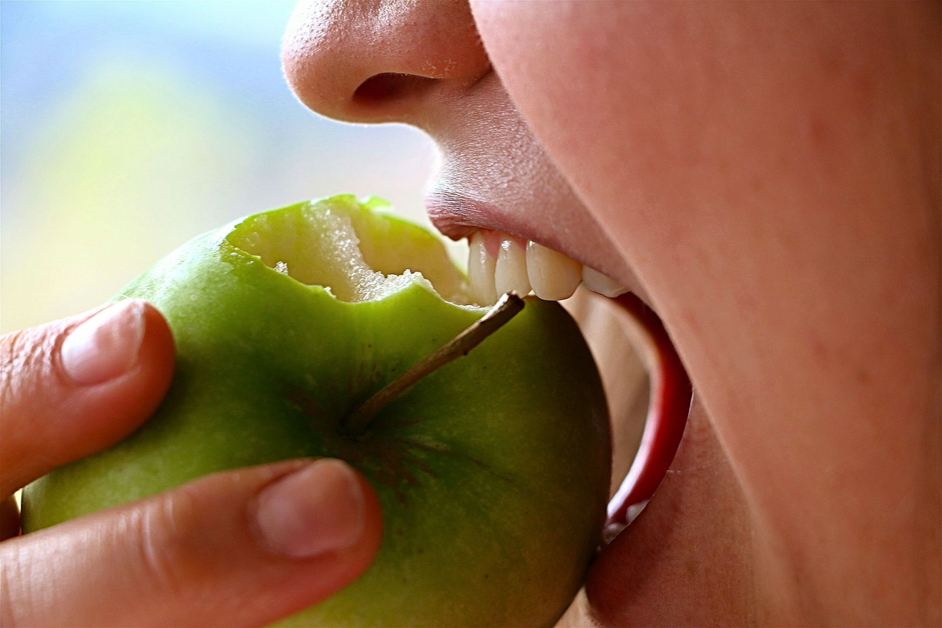 Woman biting an apple