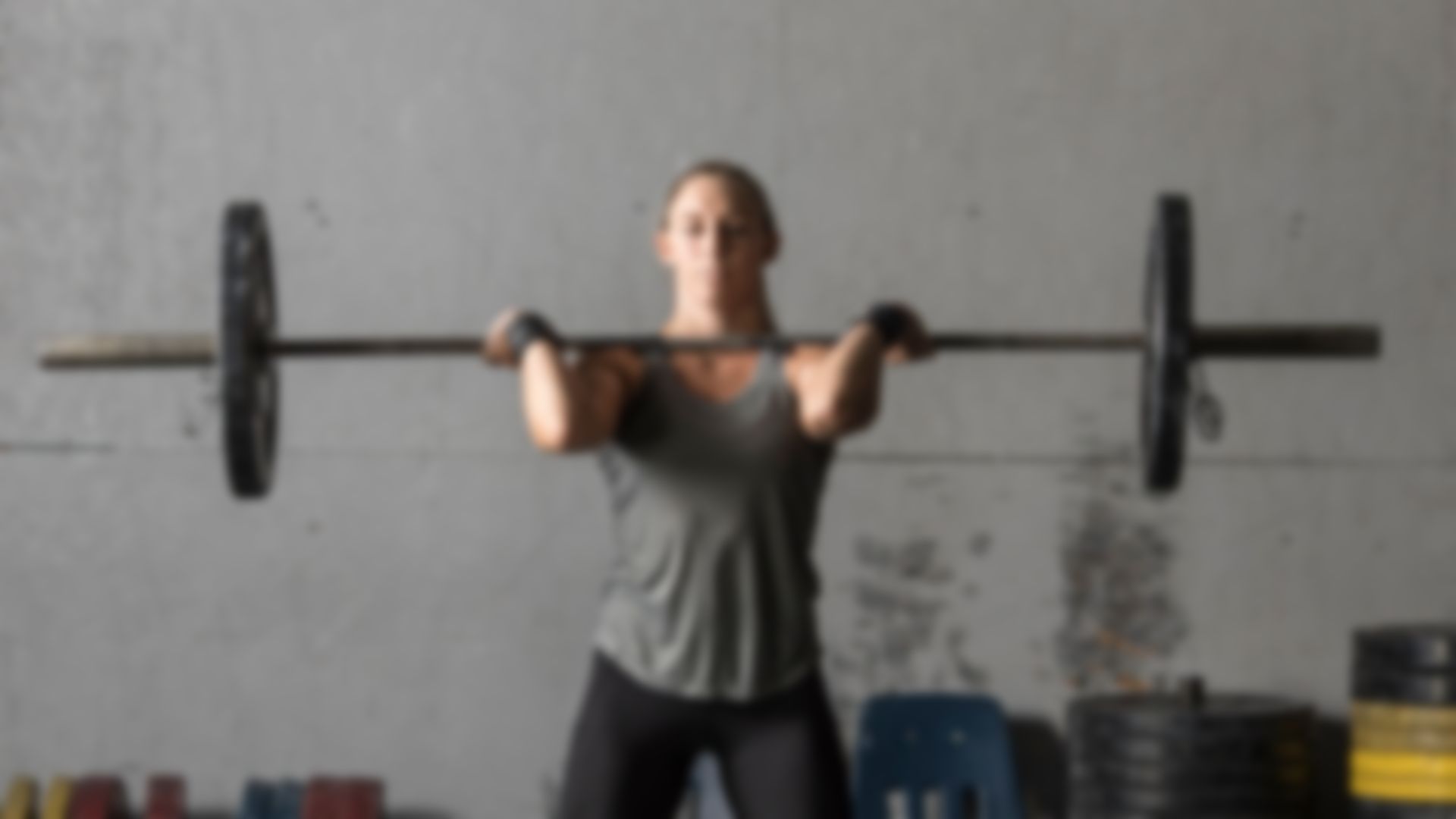 Woman catching a barbell
