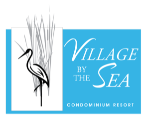 A logo for village by the sea condominium resort