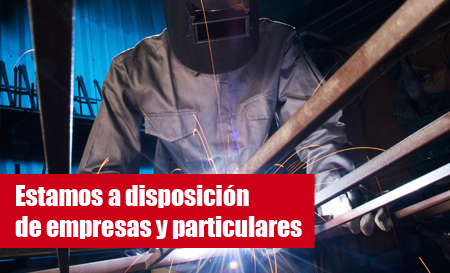 Welder at work, sparks flying, text: