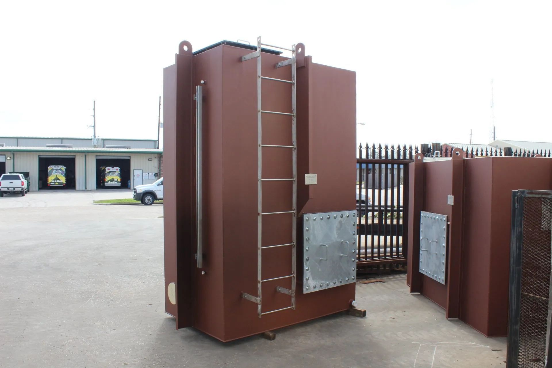A large brown container with a ladder attached to it