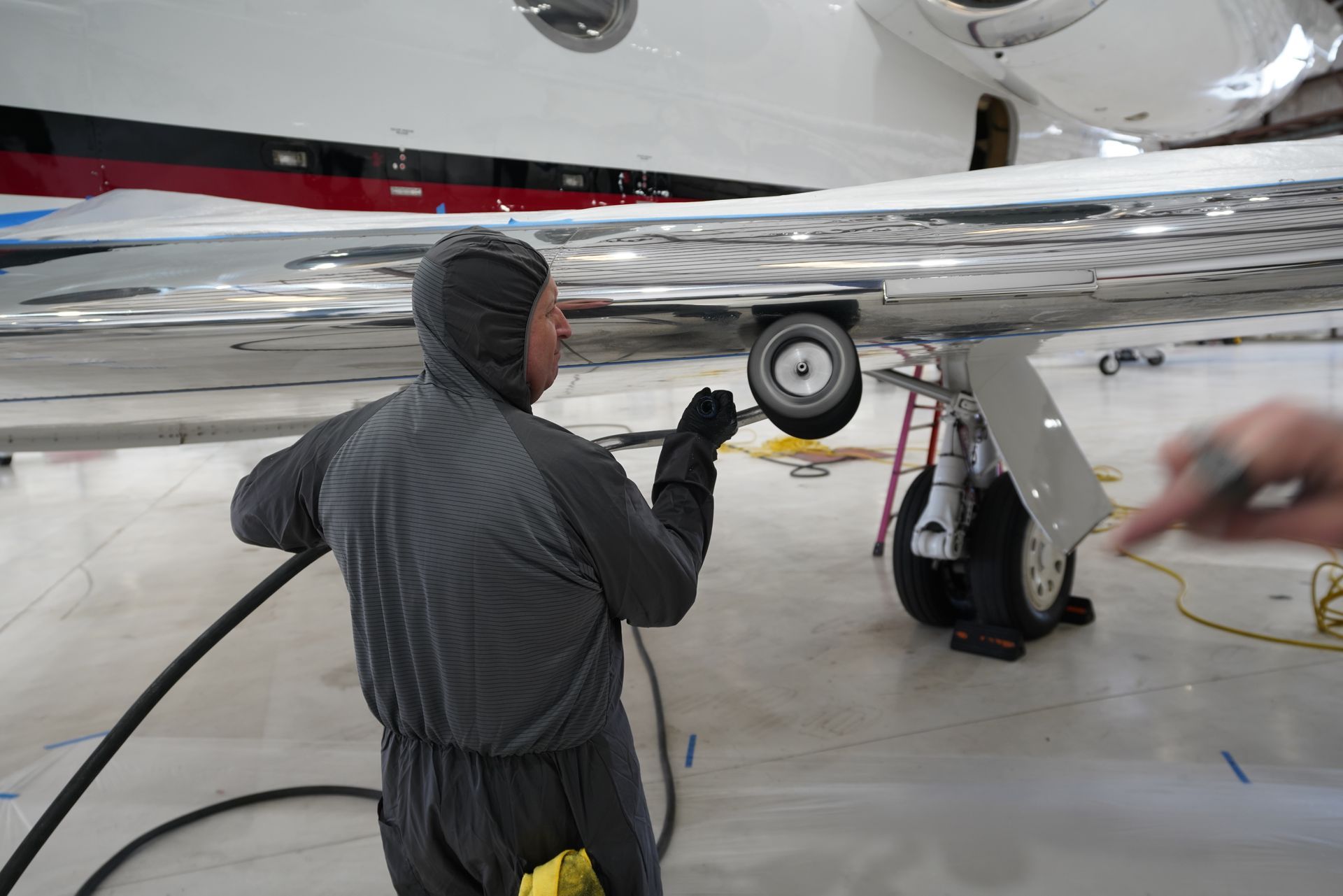 On-site aircraft detailing service performed inside hangar at DAB airport