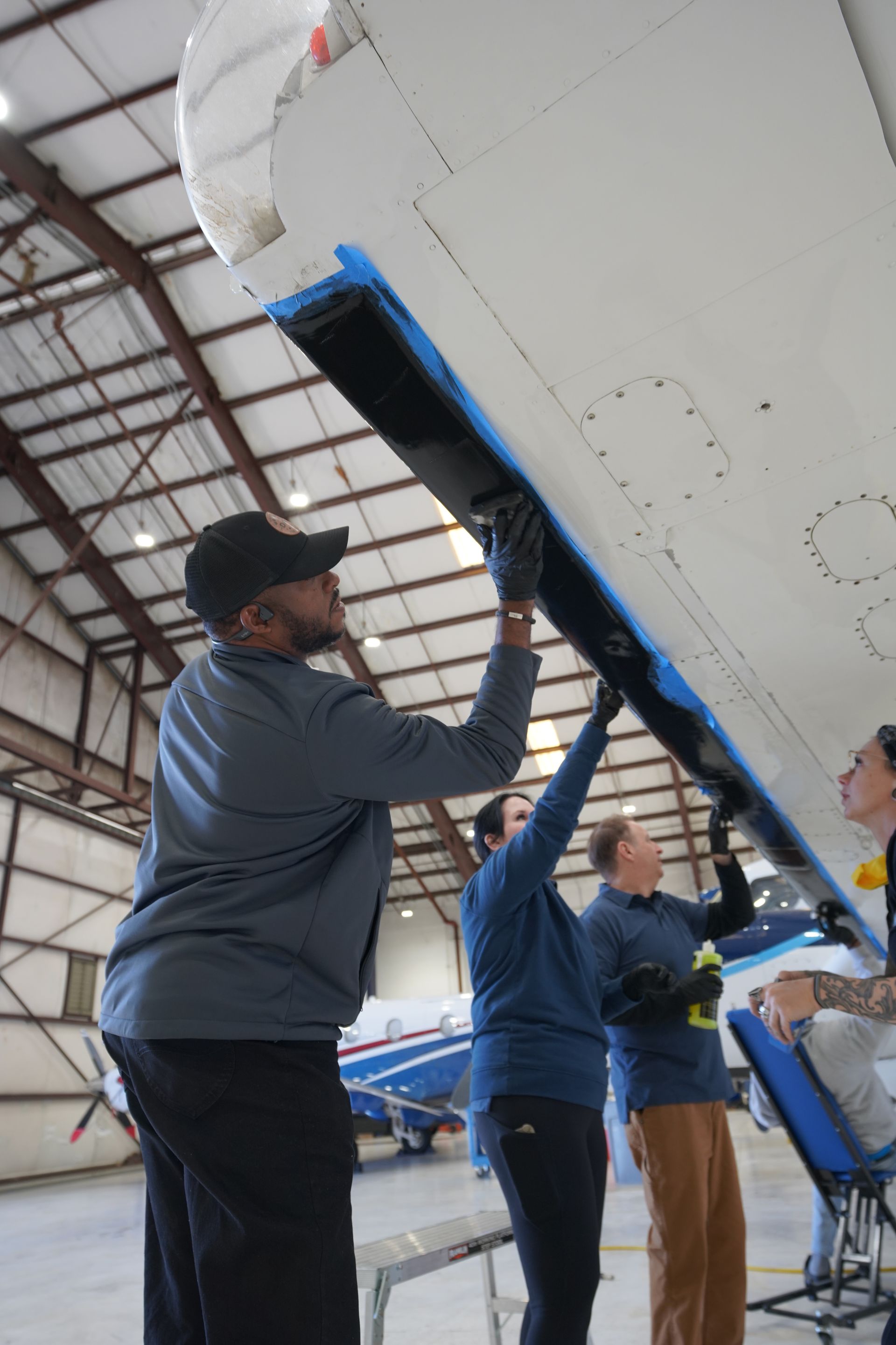 Aircraft exterior cleaning inside Florida hangar