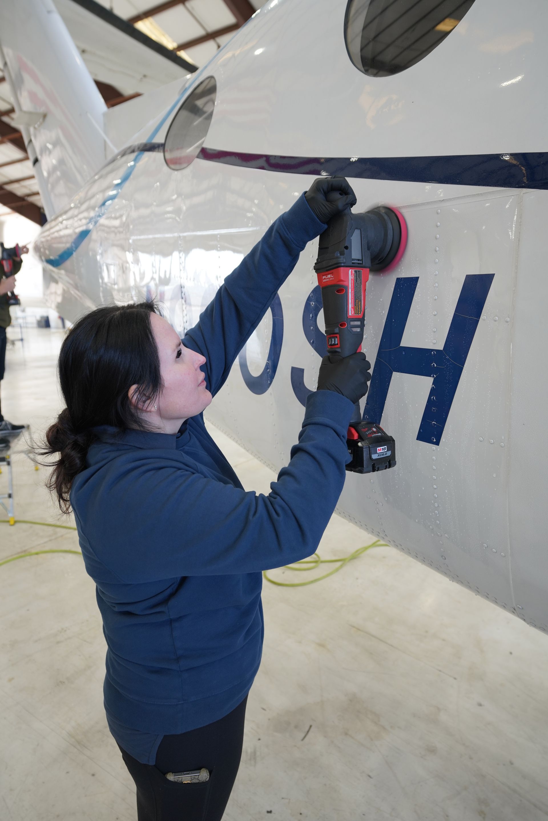 Aircraft exterior cleaning inside Florida hangar