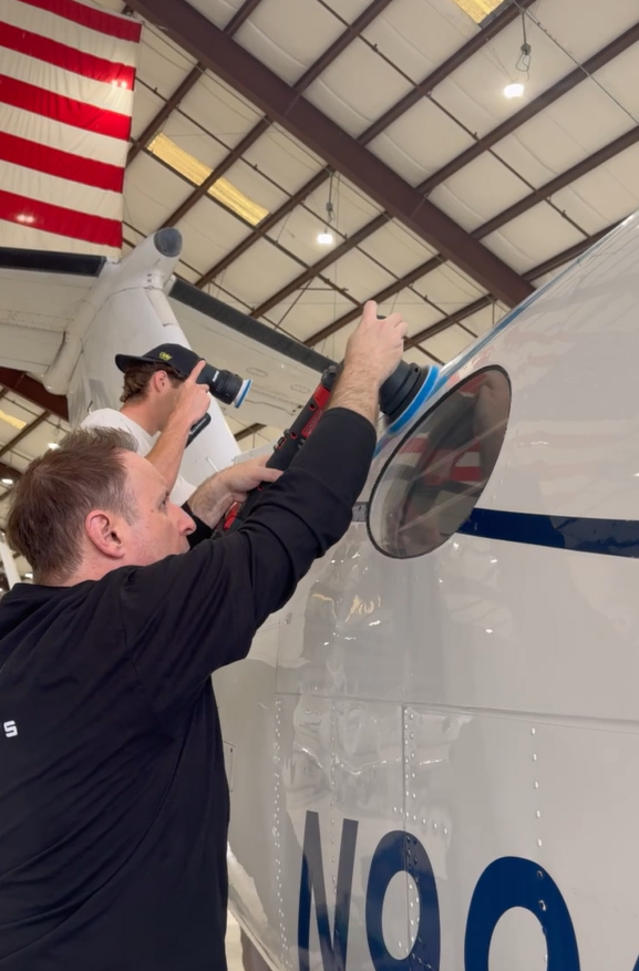 Aircraft paint polishing inside hangar in Jacksonville Florida