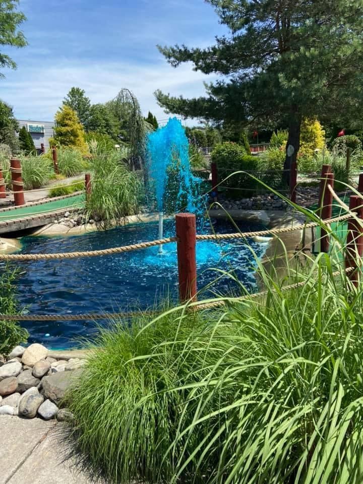 There is a fountain in the middle of the park.