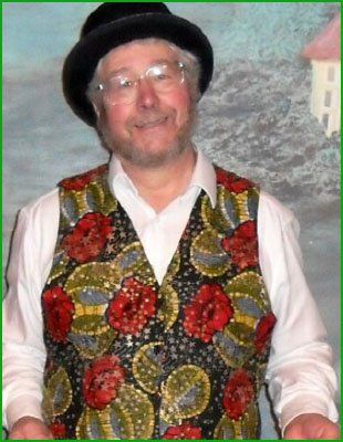 Mike dressed in a bowler hat and colourful waistcoat