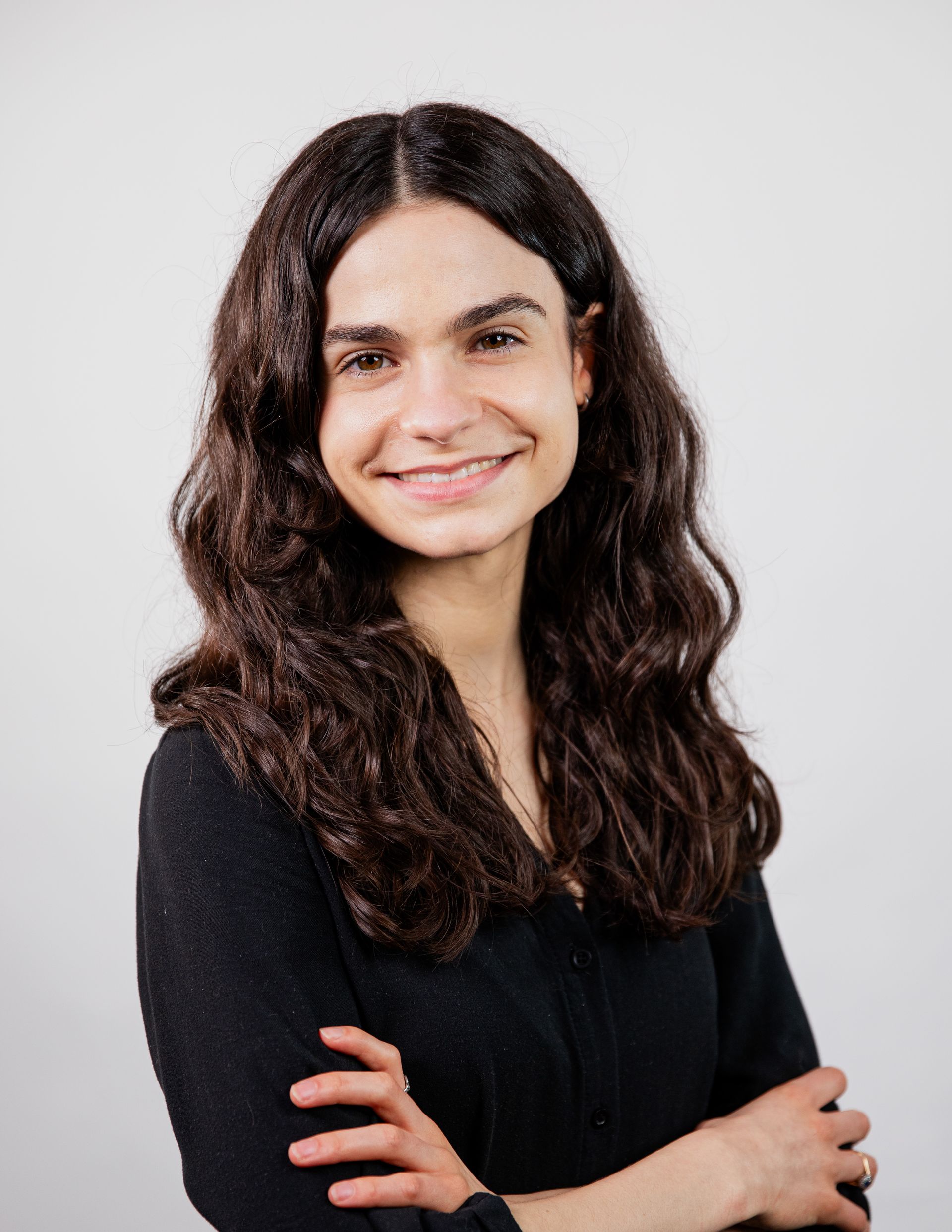 A silhouette of a person without a face on a white background.