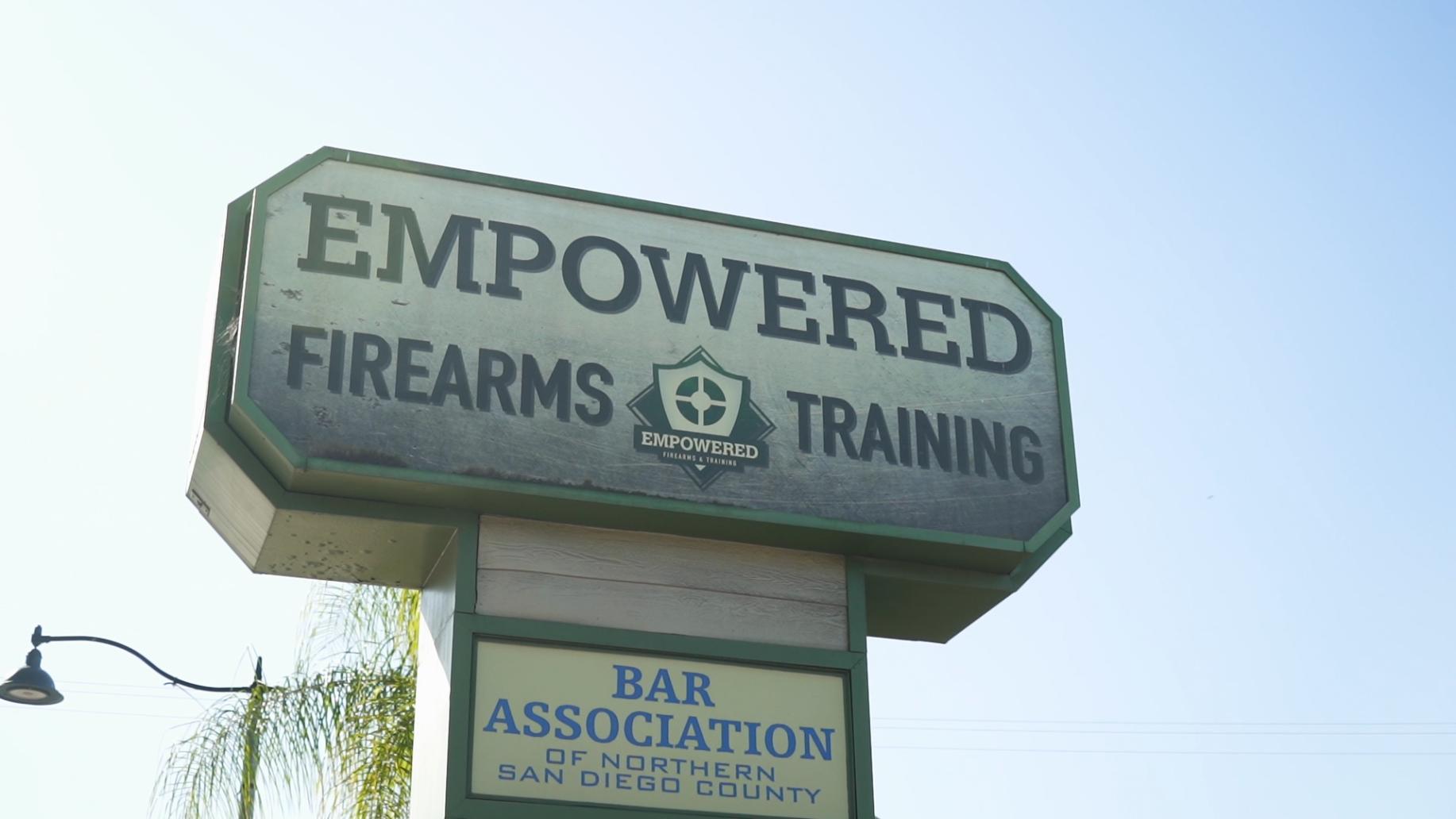 A sign that says empowered firearms training on it