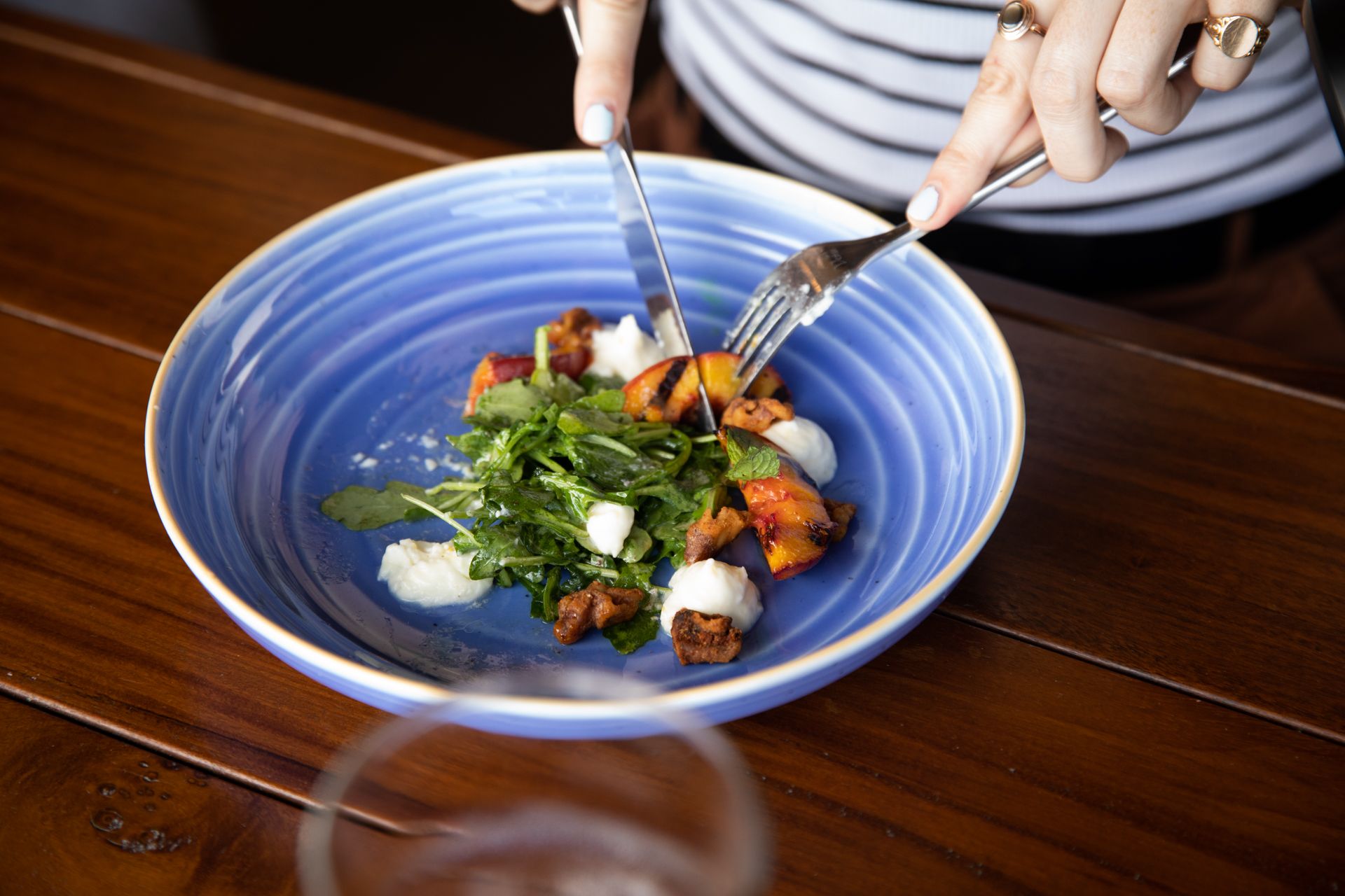 fancy gourmet food in a blue ceramic bowl