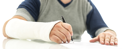 Injured person holding a pen