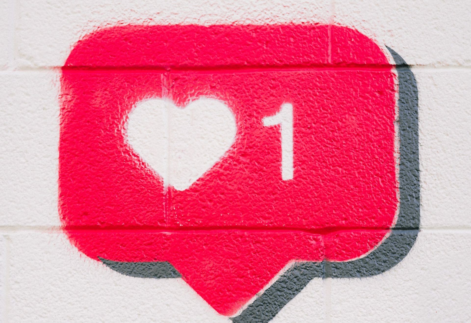 A social media like painted on a wall like graffiti