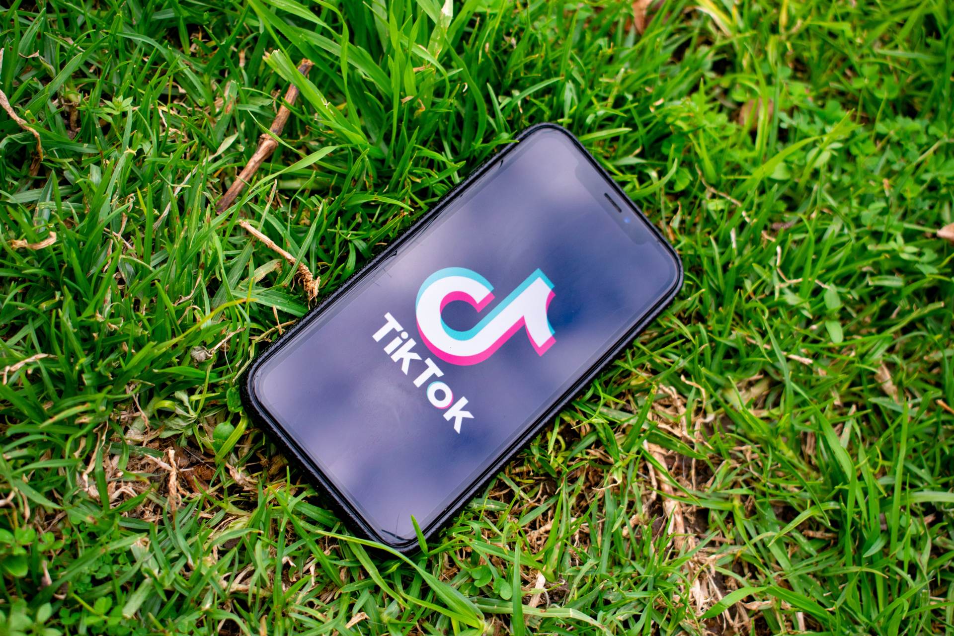 Mobile phone with TikTok app displayed on screen