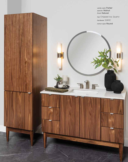 walnut Wooden bathroom vanity and tall cabinet with mirror and sconces.