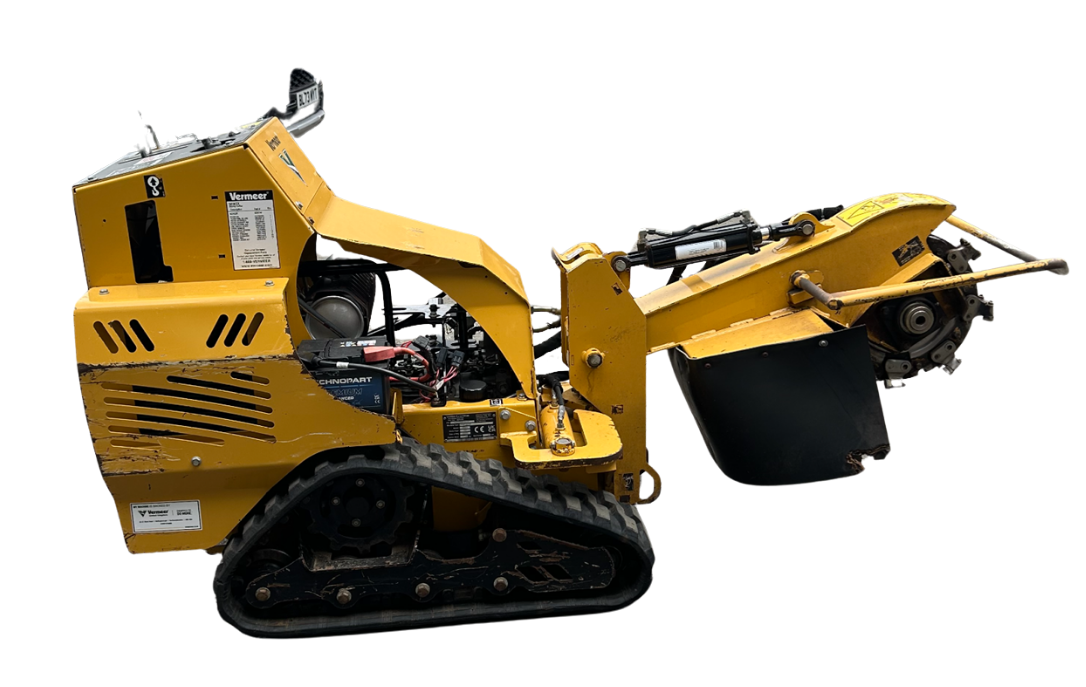 Yellow industrial stump grinder on black rubber tracks, shown from the side against a white background.