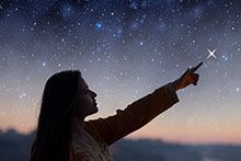 Image showing young woman stargazing, pointing at a star