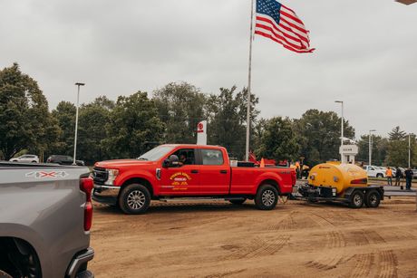 Industrial Pavement Truck Laying Fresh Asphalt — Plainwell, MI — Wyoming Asphalt Paving Co.