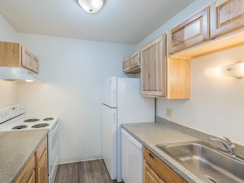 Kitchen with White Appliances | Parkwood Place in Greenly, CO