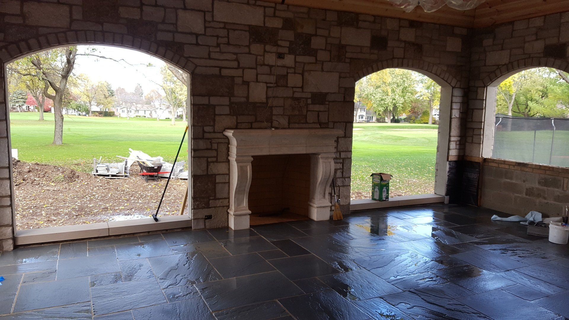 There is a fireplace in the middle of the room.