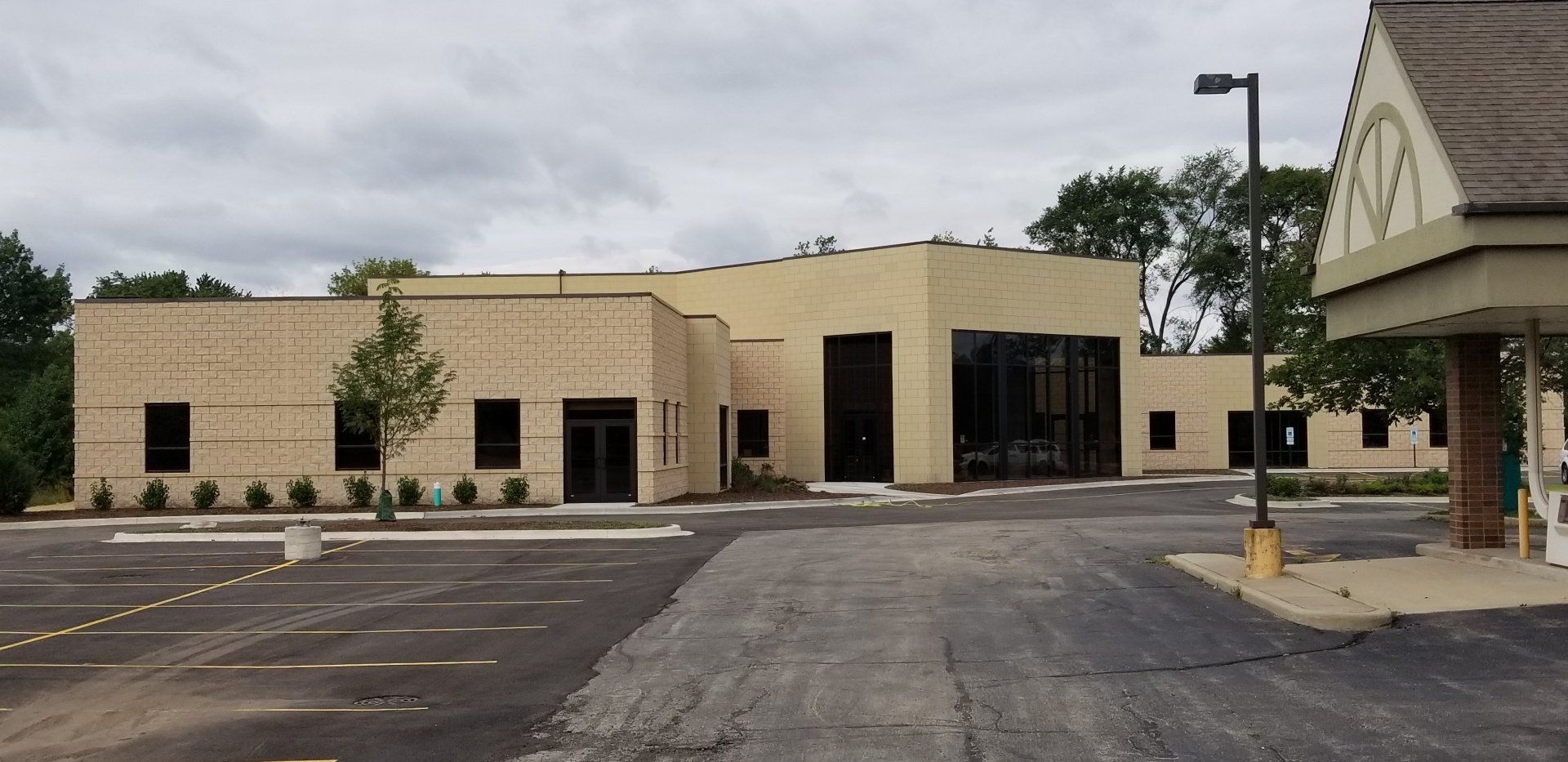 A large building with a parking lot in front of it