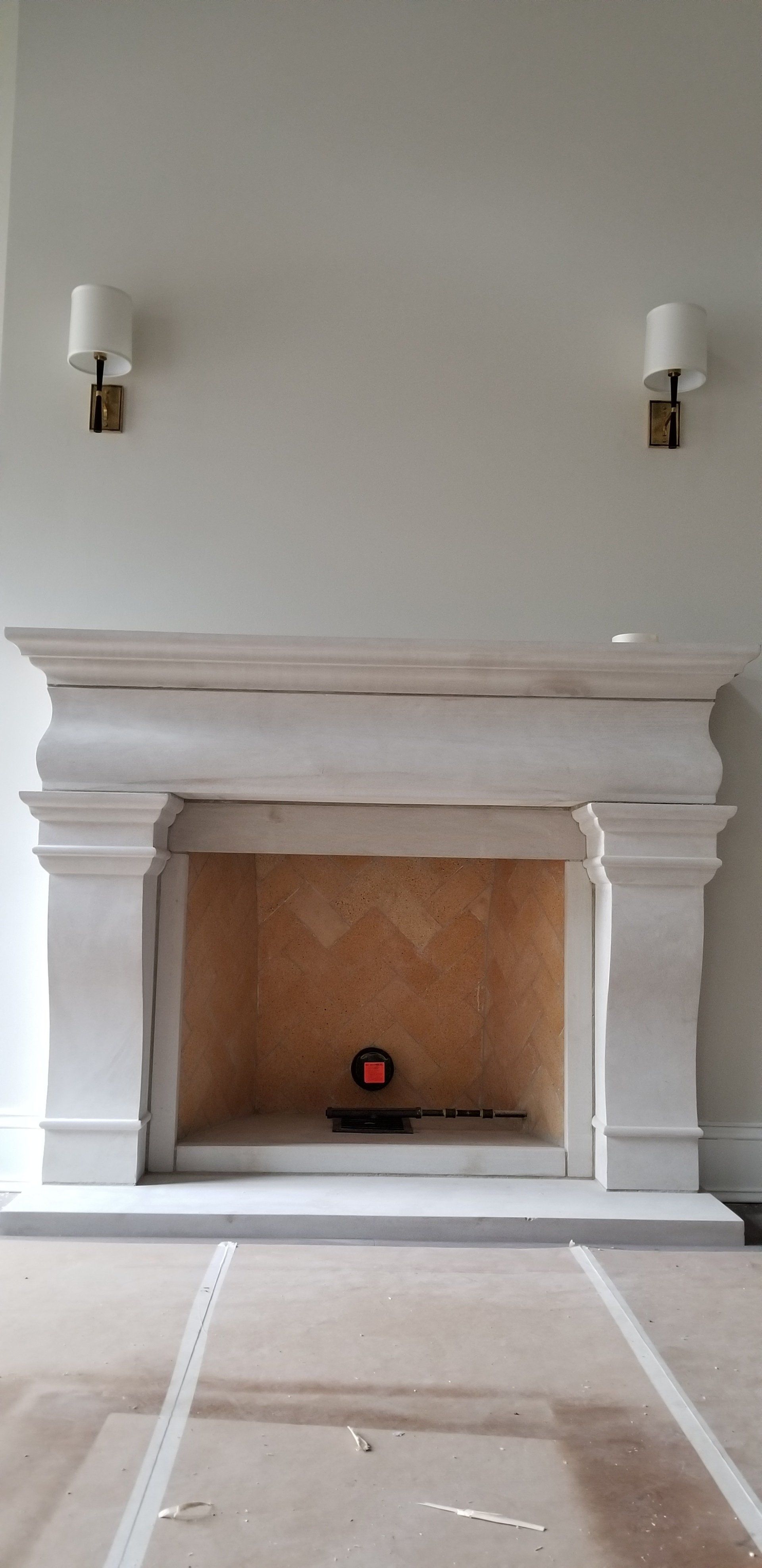 There is a fireplace in the middle of the room.