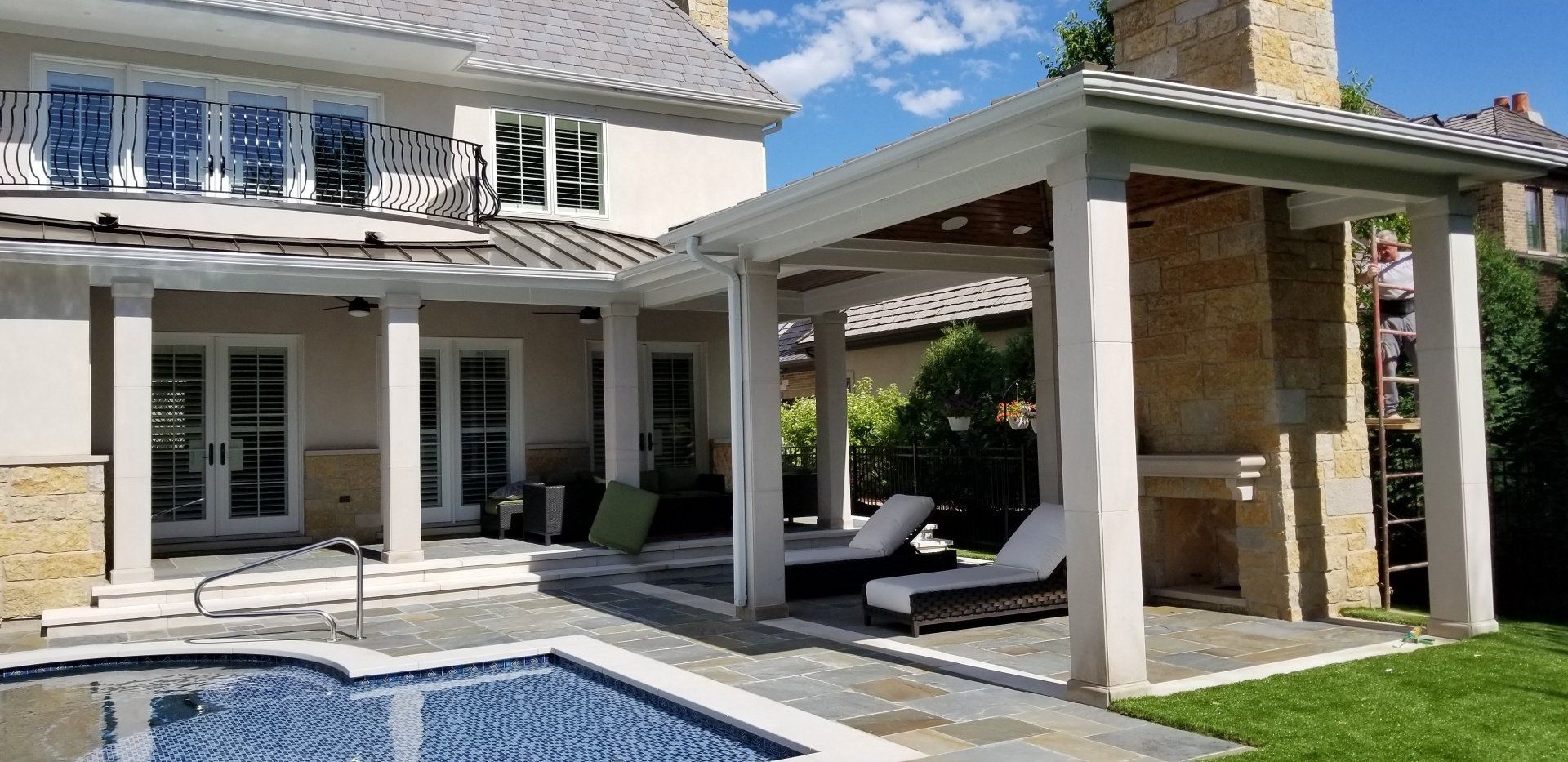A large house with a swimming pool in the backyard.