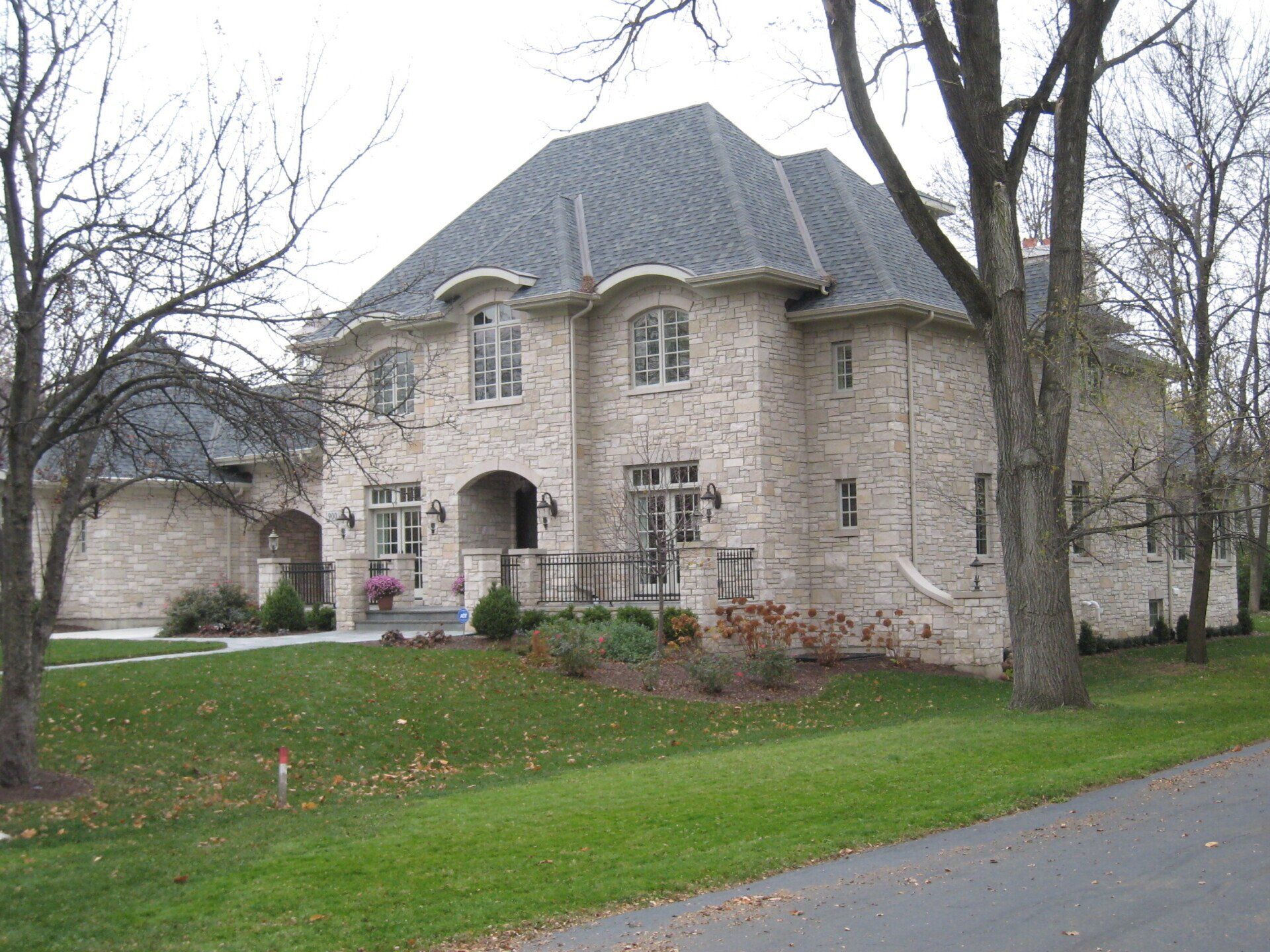 A large brick house with a gray roof