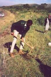 Photo: Ernest Tshabalala digging the first hole for the game fence in 2001