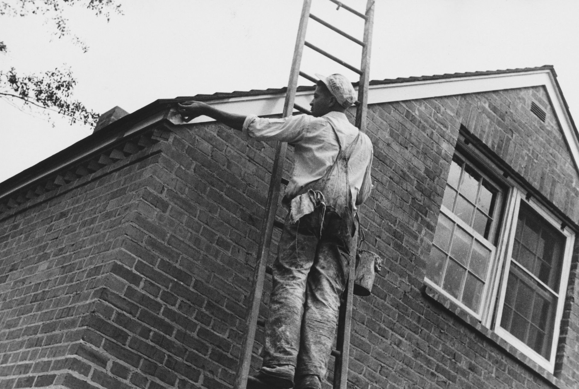 black white photo of exterior painting in the 1900s