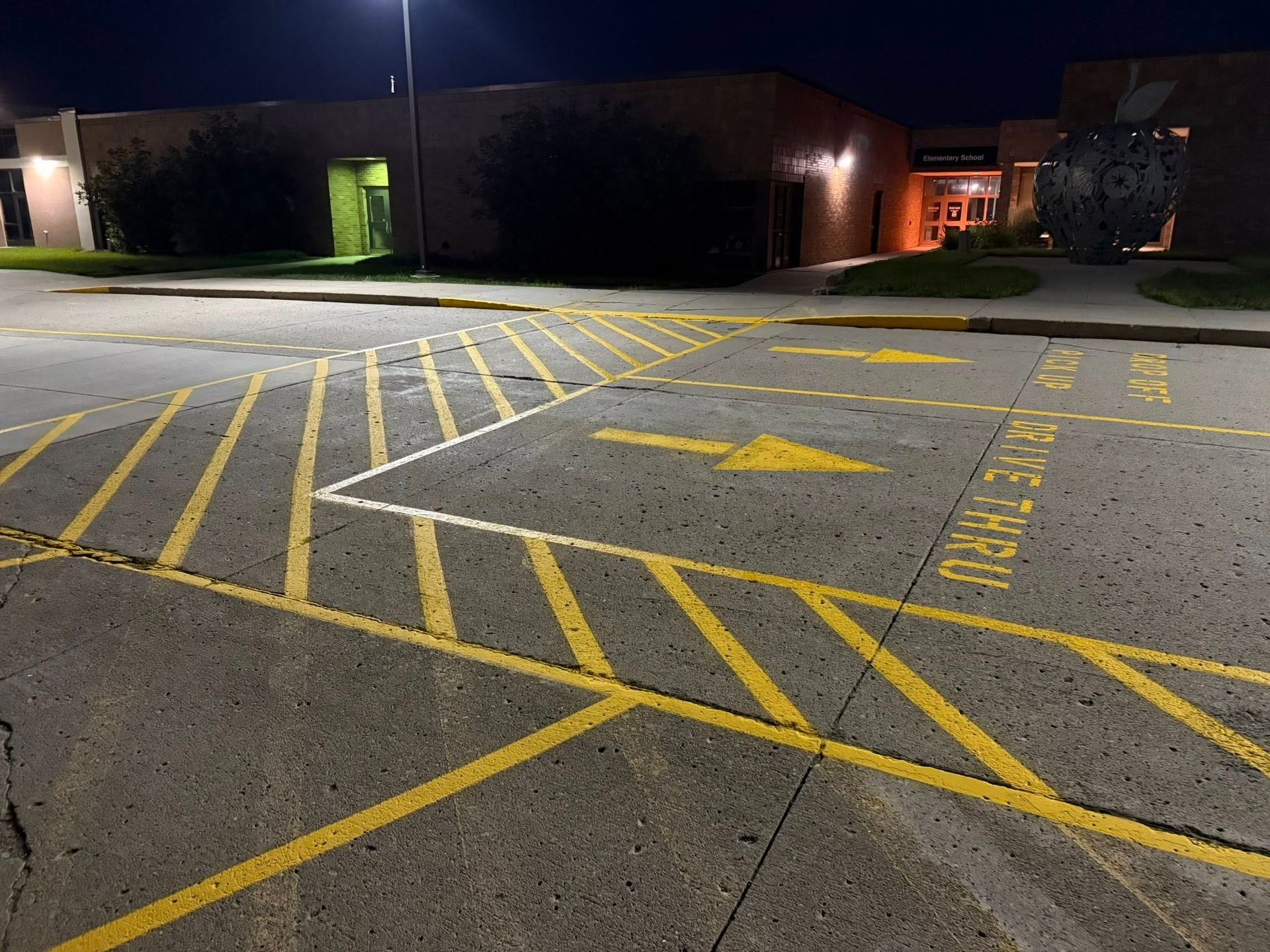 Fresh yellow parking lot striping with handicap markings and access aisles in Kansas City commercial