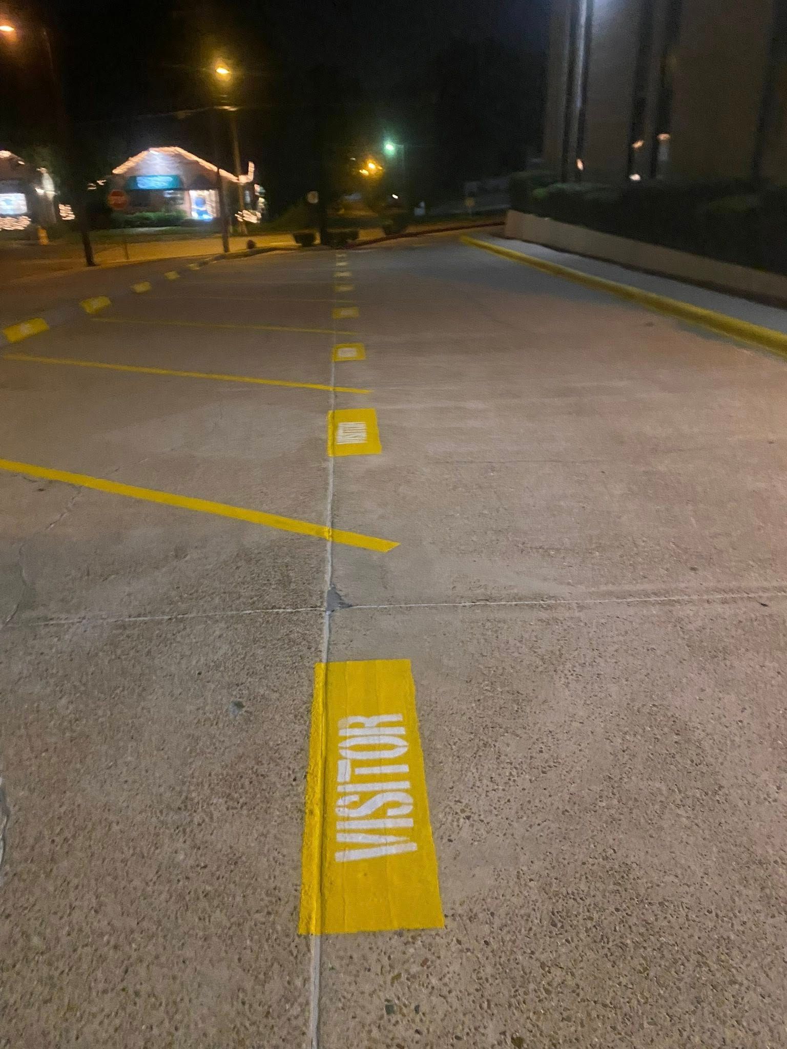 Fresh ADA handicap parking space with white striping and Kansas City skyline in background