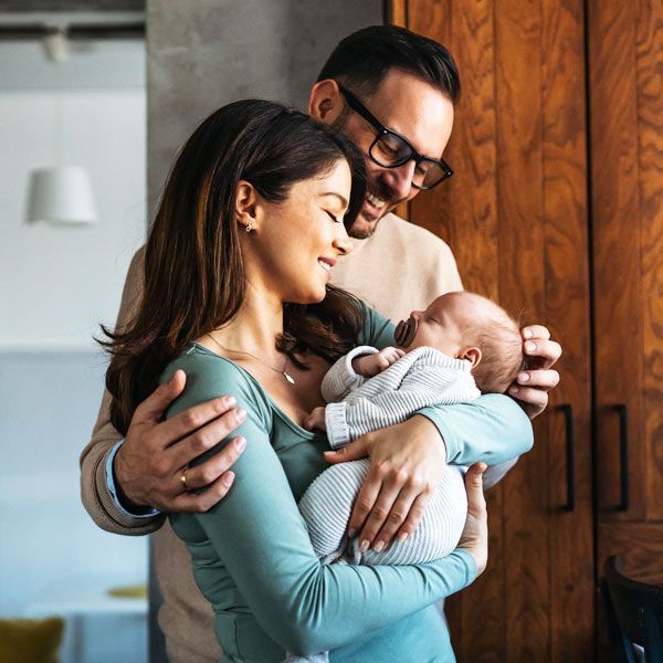 New parents happy with their baby adoption