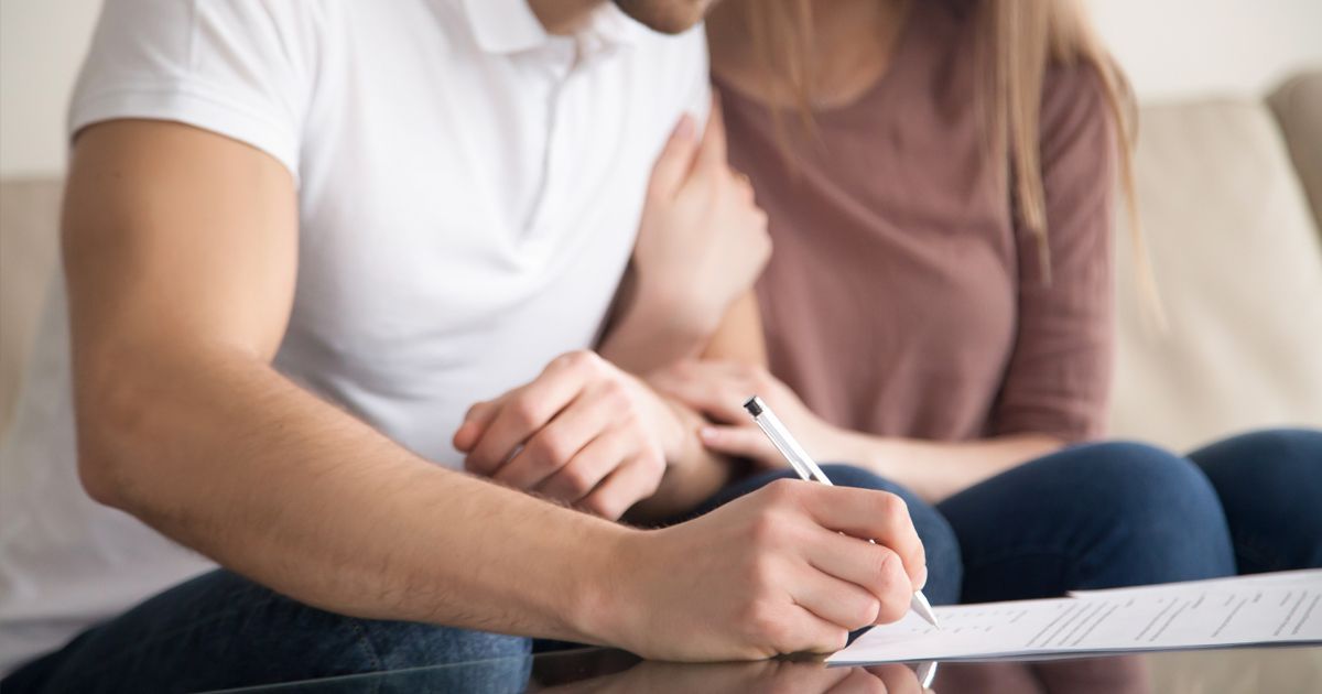 A couple signing their prenuptial agreements Syracuse from Michael Hanuszczak Esq. Prenuptial Agreement Attorney Serving Syracuse and Onondaga County NY 13031