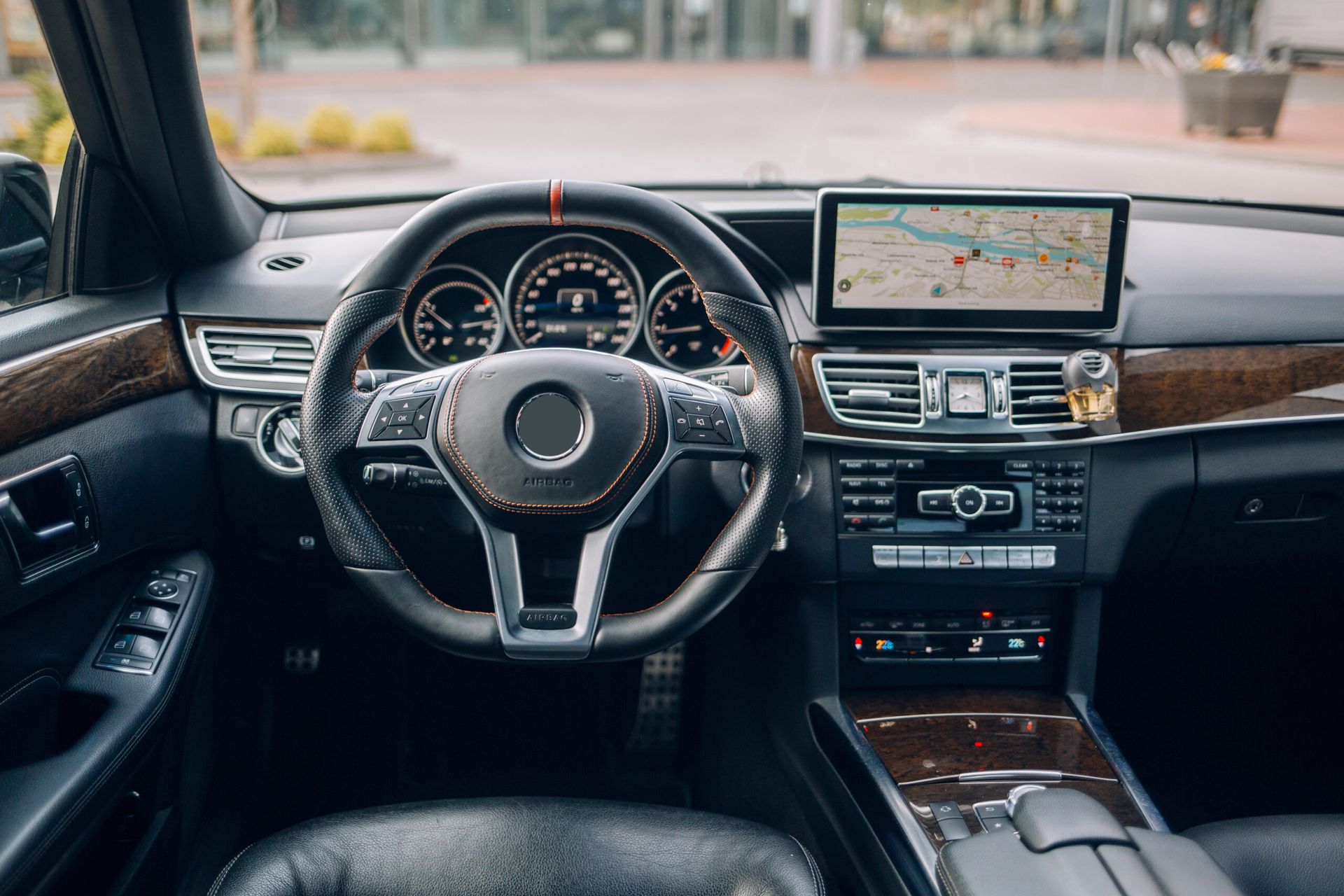 The interior of a car with a steering wheel and dashboard.