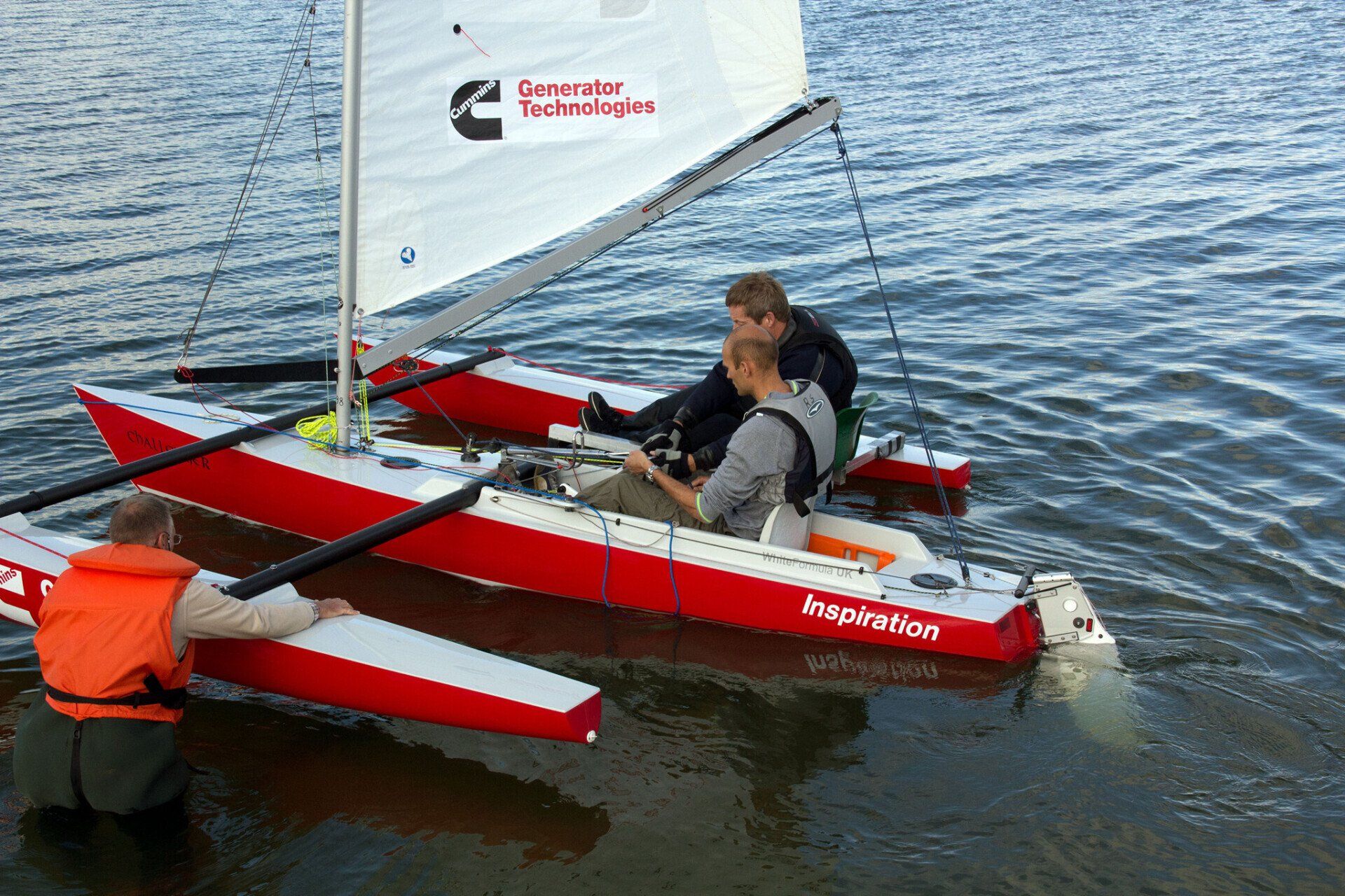 instructor and disabled sailor in a Challenger Trimaran